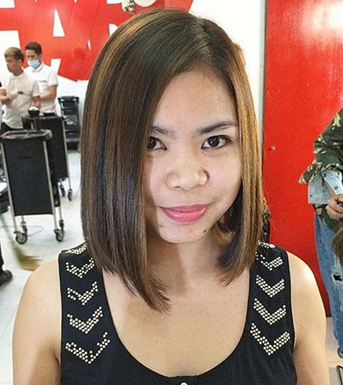 dark brown asymmetrical bob with highlights