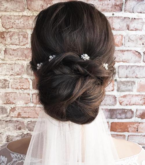 Low Wedding Bun With A Veil