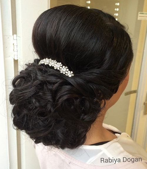 curly wedding updo with a bouffant for thick hair