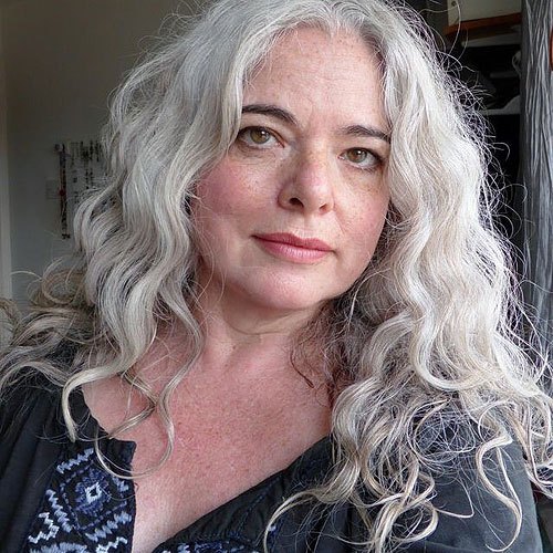 long curly gray hairstyle for older women