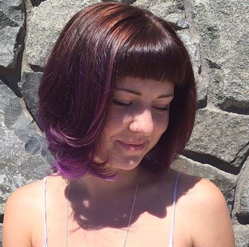 chin-length brown bob with purple face framing highlights