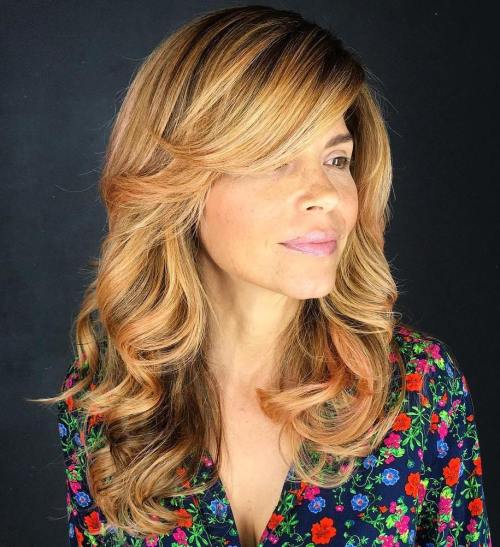 Golden Blonde Layered Hairstyle With Side Bangs