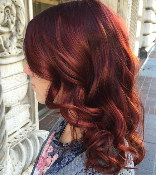 long copper red hairstyle with bangs