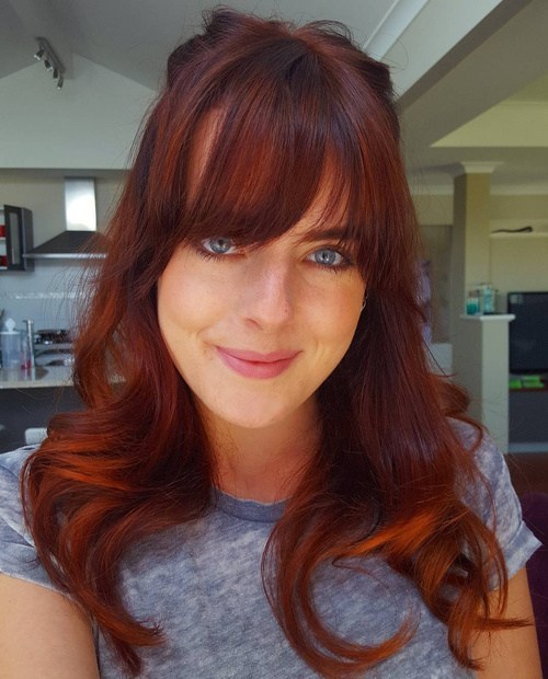 auburn and copper balayage hair with bangs