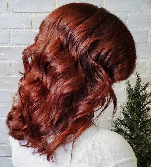 mid-length shiny auburn waves hairstyle