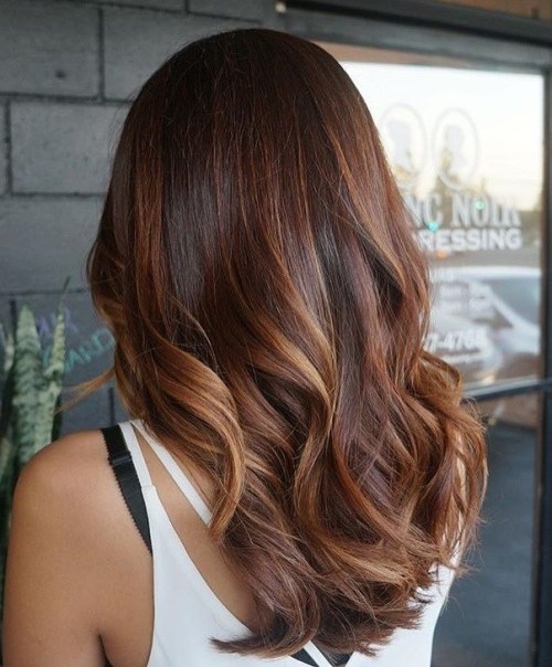 long dark brown hair with auburn balayage