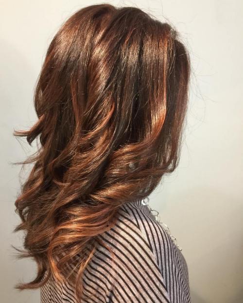 medium length wavy auburn balayage hair