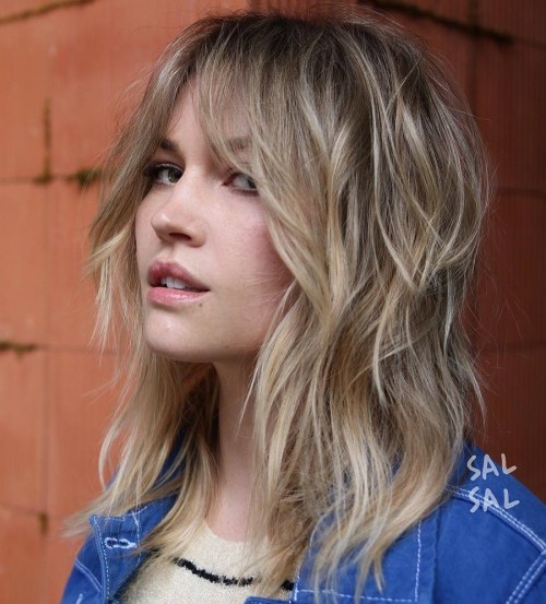 Medium Shaggy Blonde Hairstyle With Bangs