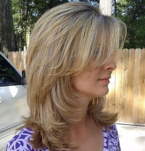 medium layered haircut with side bangs