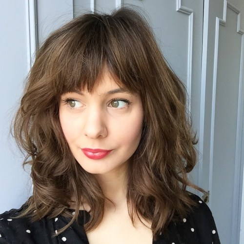 Medium Layered Haircut With Straight Bangs