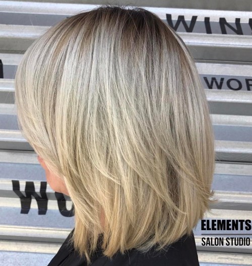 Blonde Layered Bob With Stretched Roots