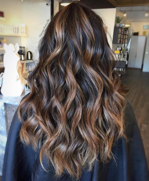 long brown hairstyle with golden blonde highlights
