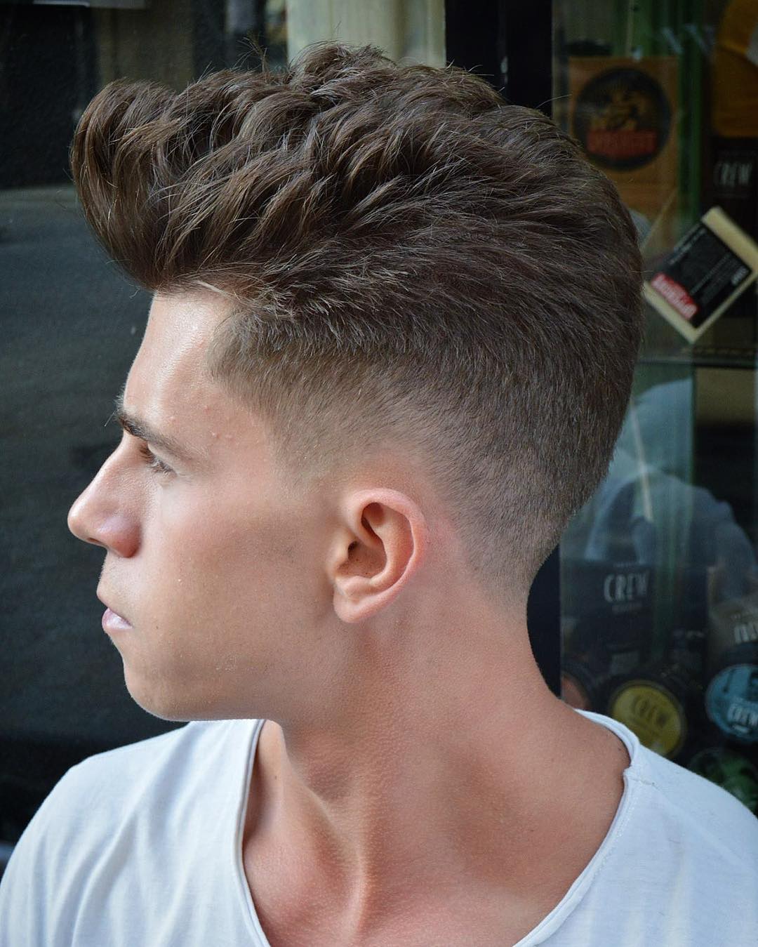 Short men's haircut for thick hair with mid to low fade