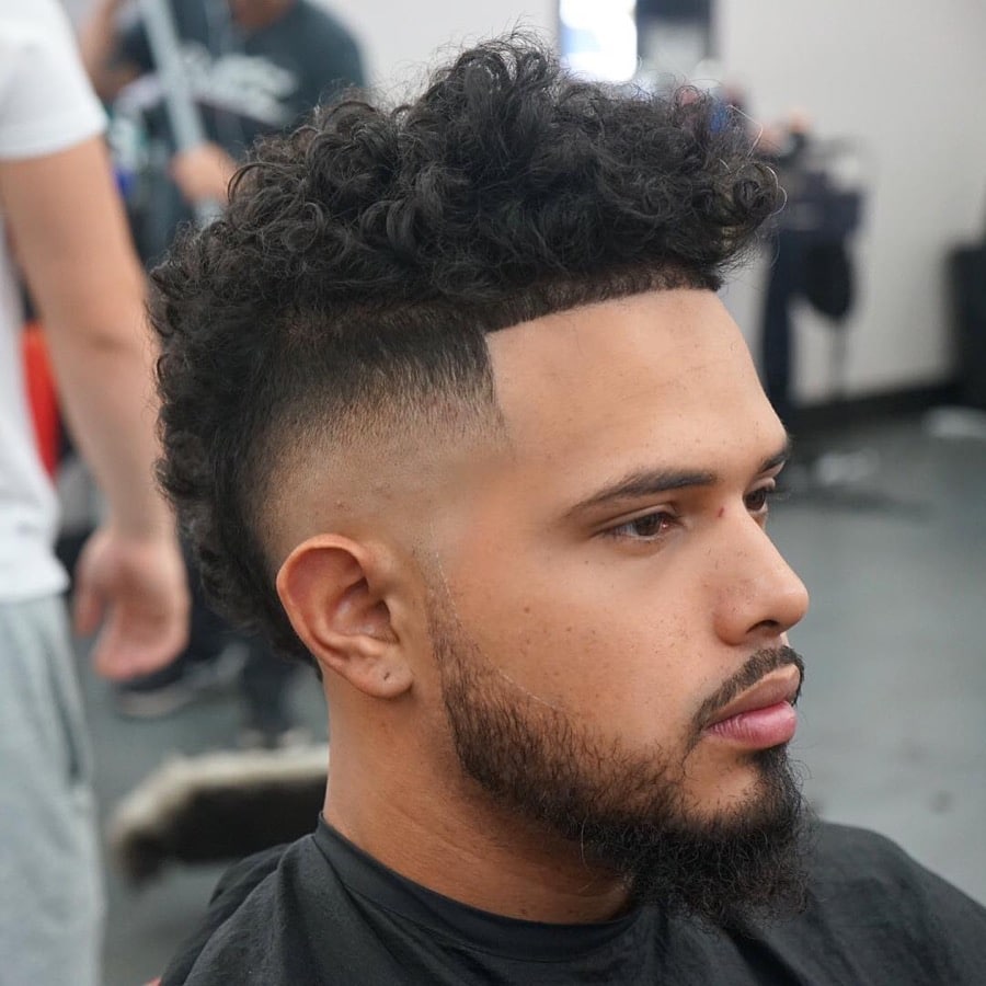 Mohawk hairstyle for curly hair and shape up front with bald fade