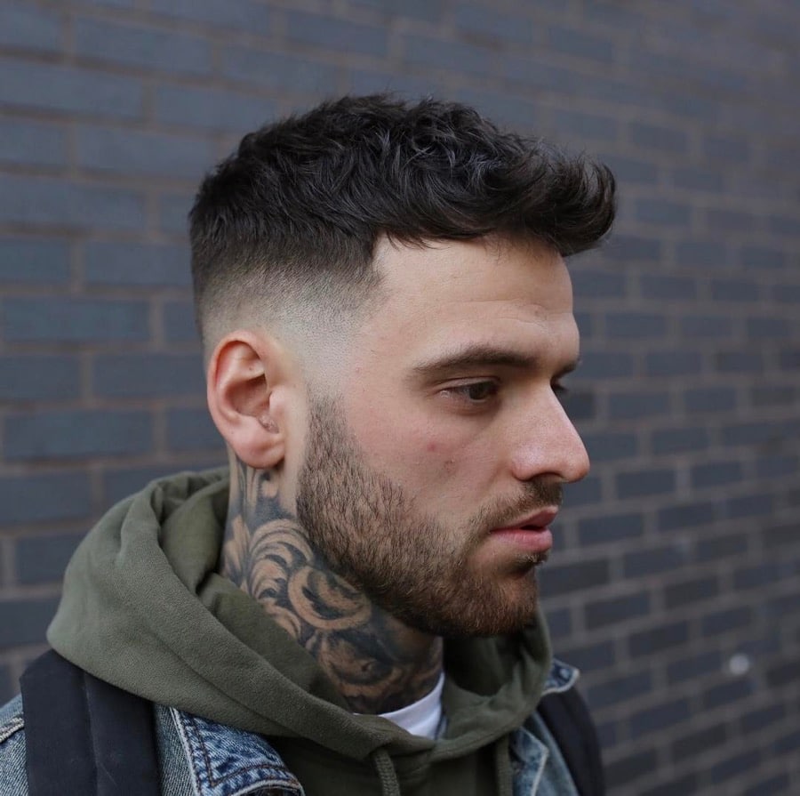 Short mens quiff haircut with mid fade