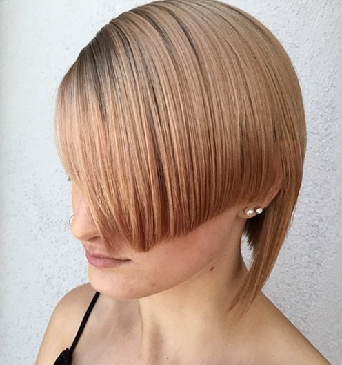 short angled asymmetrical strawberry blonde hairstyle